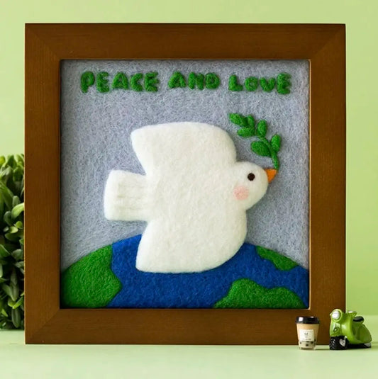 Peace Dove framed needle felting picture: white felted dove on a green background, one possible mystery box design