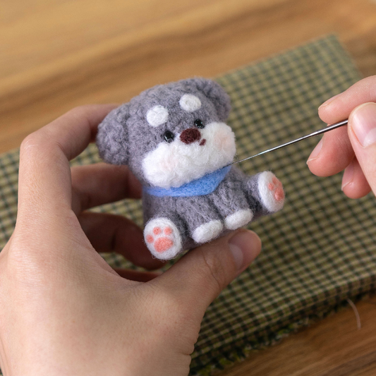 Finished Faithful Schnauzer felt dog with blue scarf.