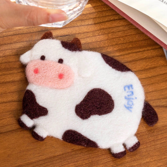 Finished Enjoy Cow felt coaster with ‘Enjoy’ text.”