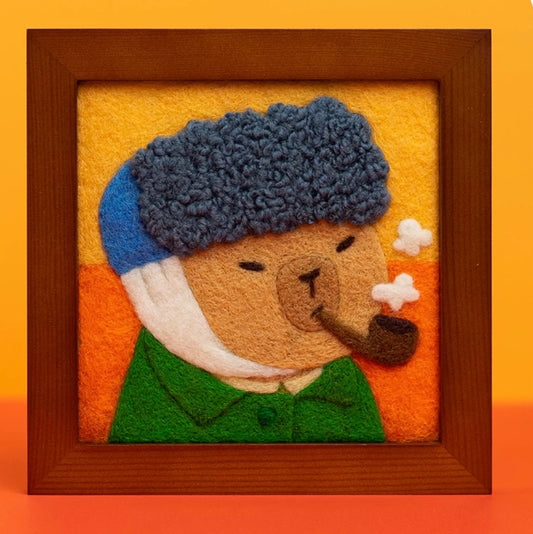 Finished Van Gogh Bear felt figure with pipe and blue hat.