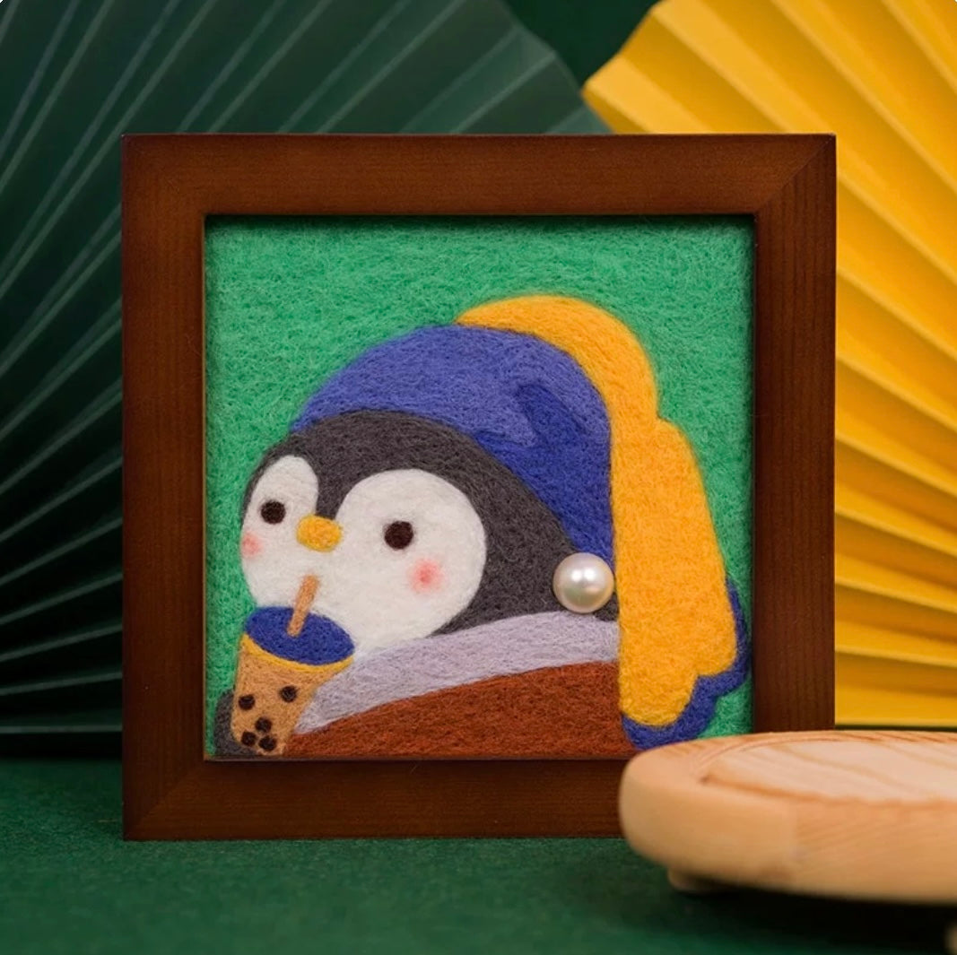 Finished Milk Tea Penguin felt frame with pearl earring and boba cup.