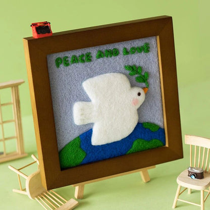Finished Peace Dove felt frame with white dove and olive branch.