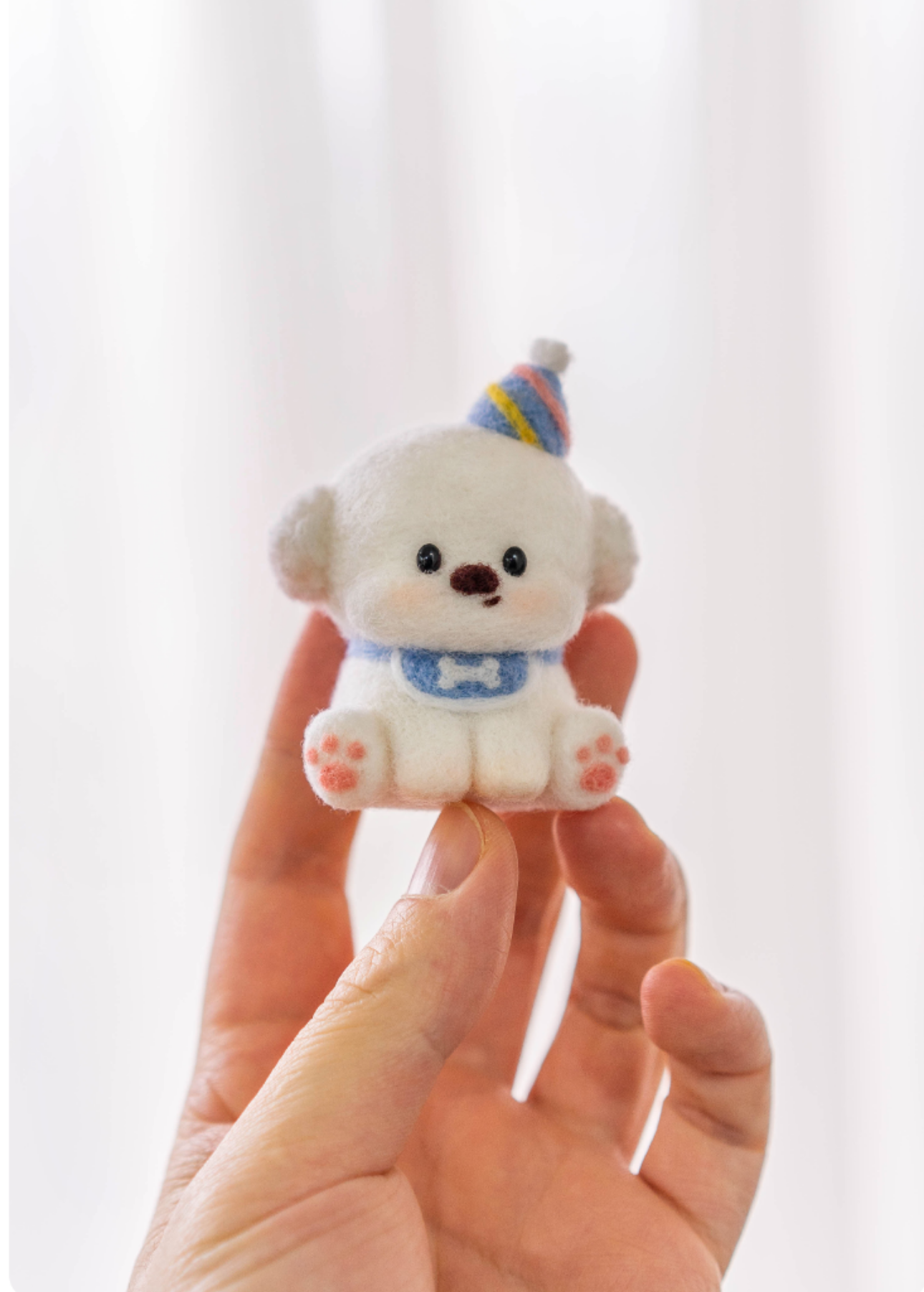 Finished Birthday Bichon felt dog side view.