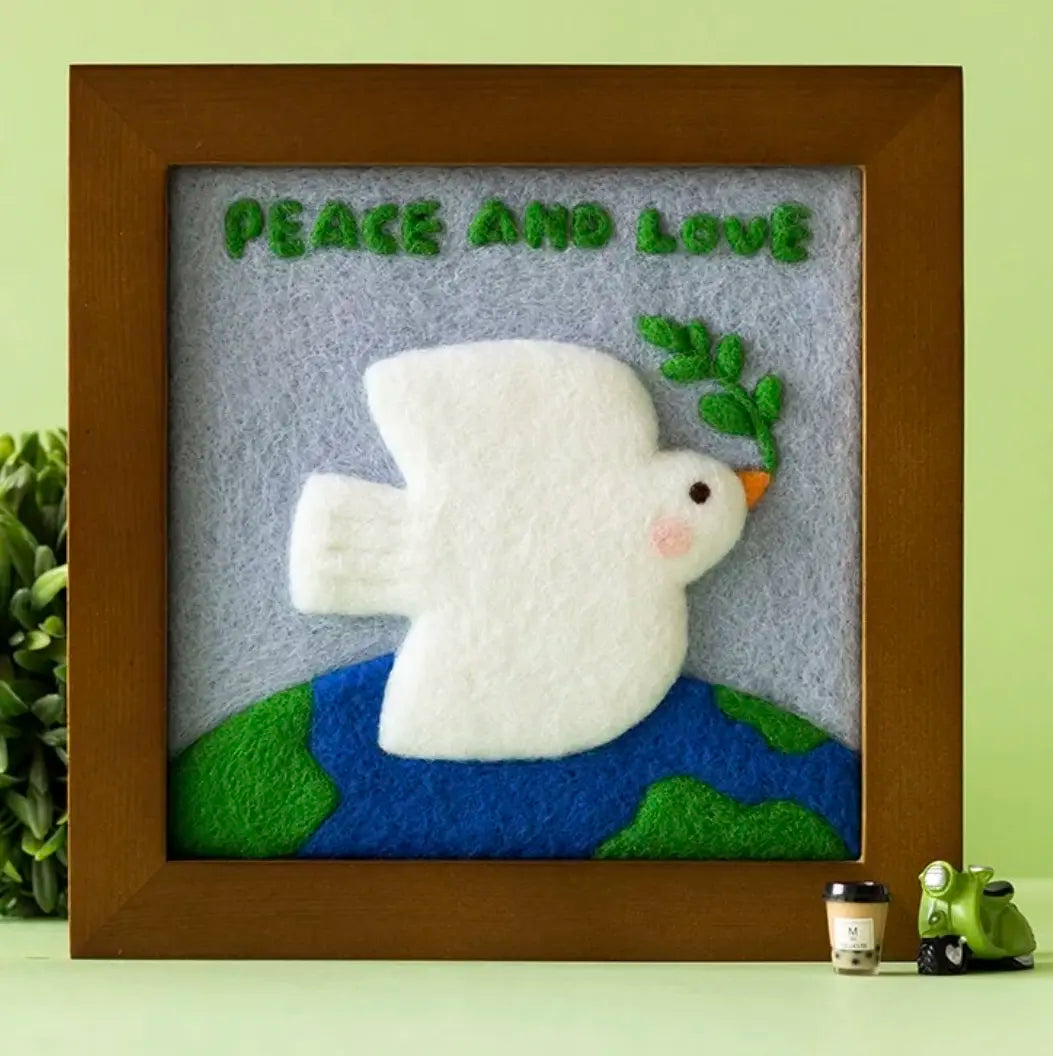 Peace Dove framed needle felting picture: white felted dove on a green background, one possible mystery box design
