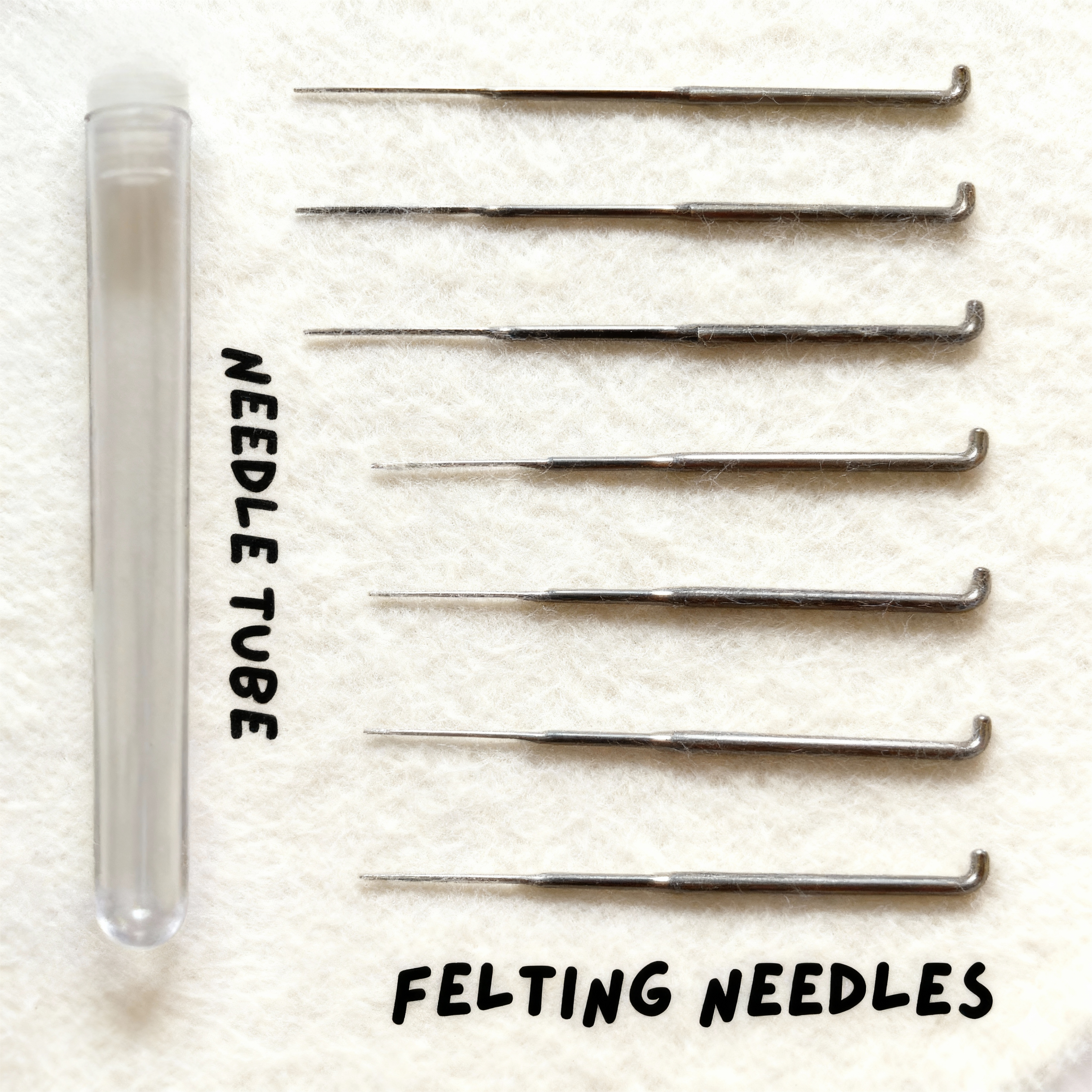 Seven felting needles in mixed sizes with a clear storage tube from Joypok