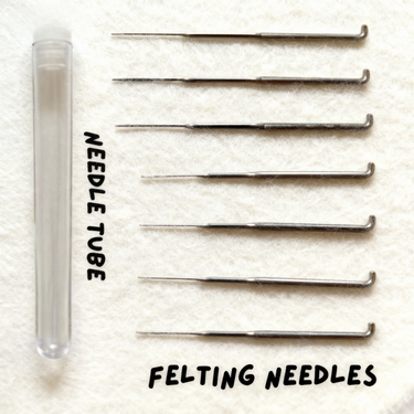 Seven felting needles in mixed sizes with a clear storage tube from Joypok