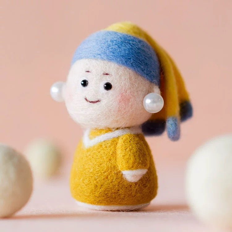 Finished Girl with a Pearl felt doll with blue headscarf and pearl earring.