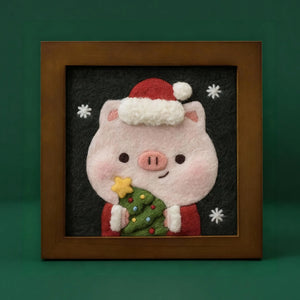 Finished Christmas Piggy wool felt frame with Santa hat and tiny tree, made from the Joypok beginner needle felting kit