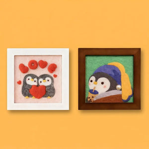 Penguin Frame needle felting kit: framed felt penguin couple with red hearts and a framed penguin portrait