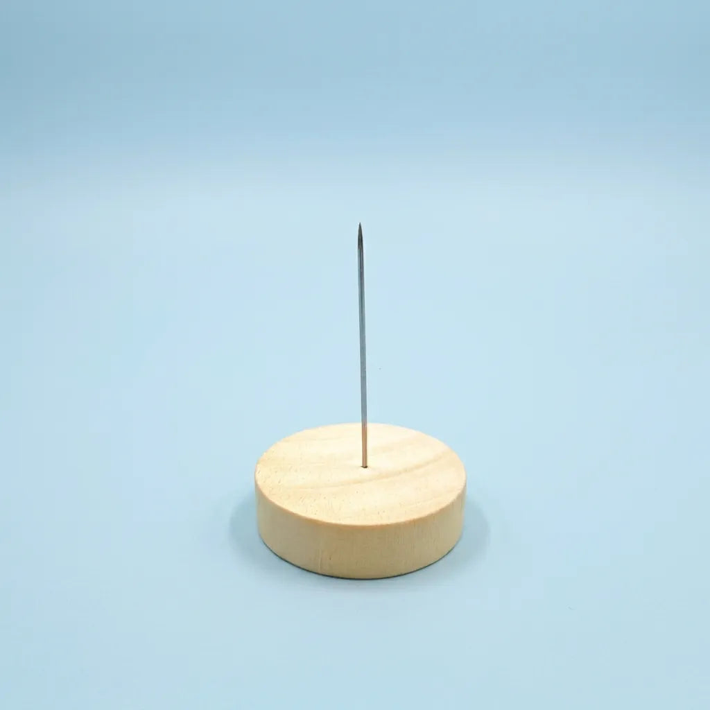 Wooden felting display base with a steel display pin from Joypok